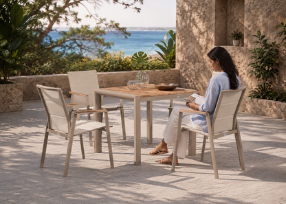 Kyote-Chair in Kutch Sandstone Terrace with Indian model – lifestyle view