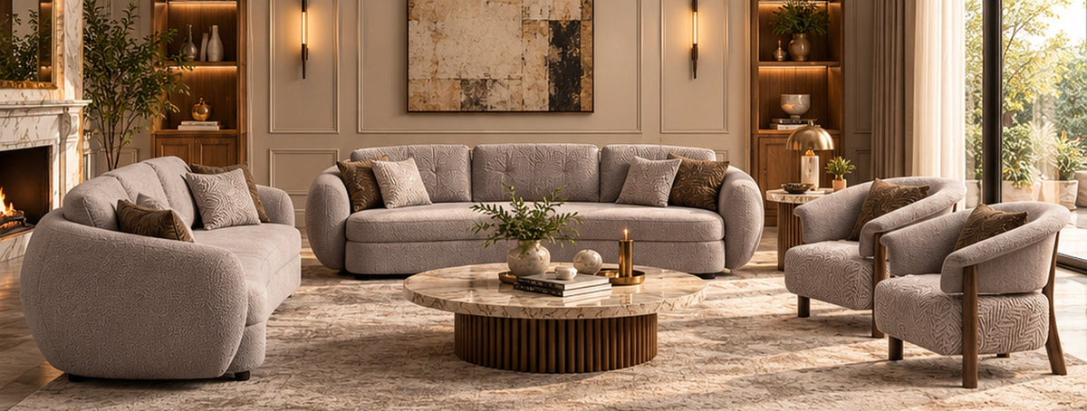 Luna luxury sofa formal living room with two matching Lune petal-textured accent armchairs, neutral taupe upholstery and sculptural marble centre table