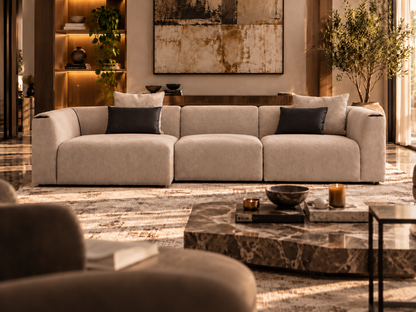 Soho L-shape luxury beige greige chaise sectional sofa in warm contemporary living room with marble centre table and soft architectural lighting