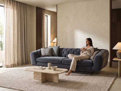 Manchester Soft Sofa in a warm luxury living room with a relaxed seated woman