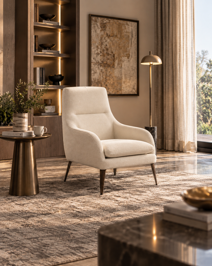 Mila Armchair in a warm luxury reading nook with ivory upholstery