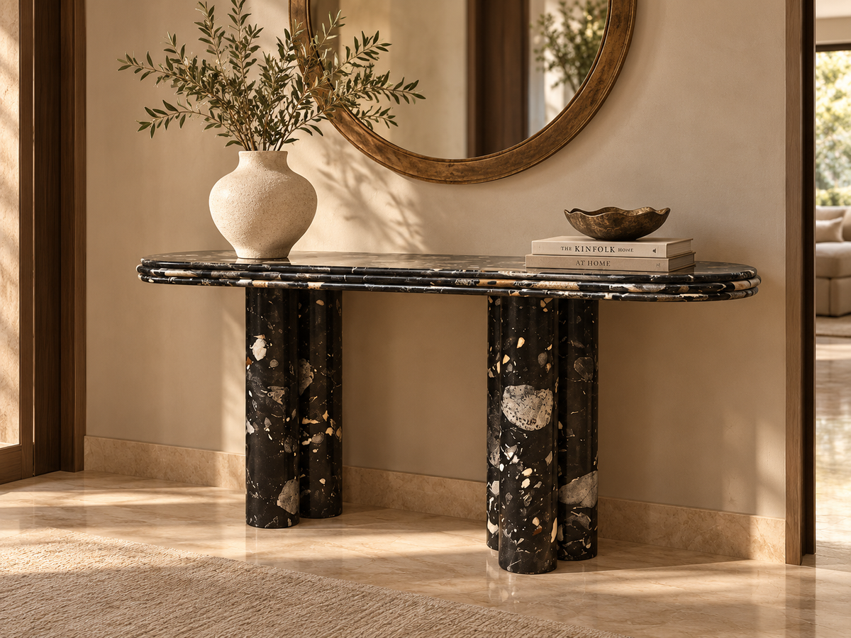 Cavaro Sculptural Marble Console, black and ivory stone-effect console with rounded layered tabletop and cylindrical legs in luxurious entryway