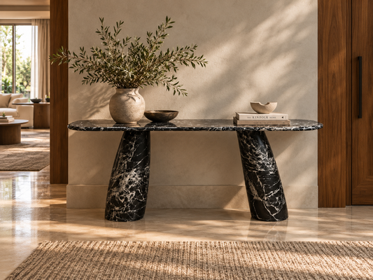 Noir Tilt black and white marble console with twin matching angled tapered legs in a luxury entryway