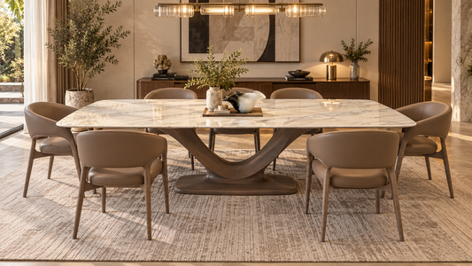 Luxury 8-seater dining table with strong marble top and sculptural solid oak wood base in a cozy dining room