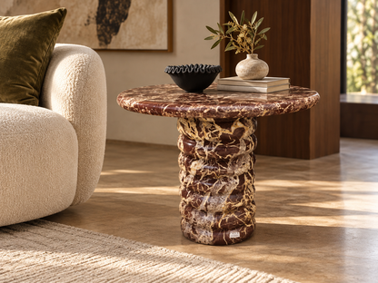 Orsino burgundy breccia marble side table with rounded top and sculptural stacked ribbed pedestal in luxury living room
