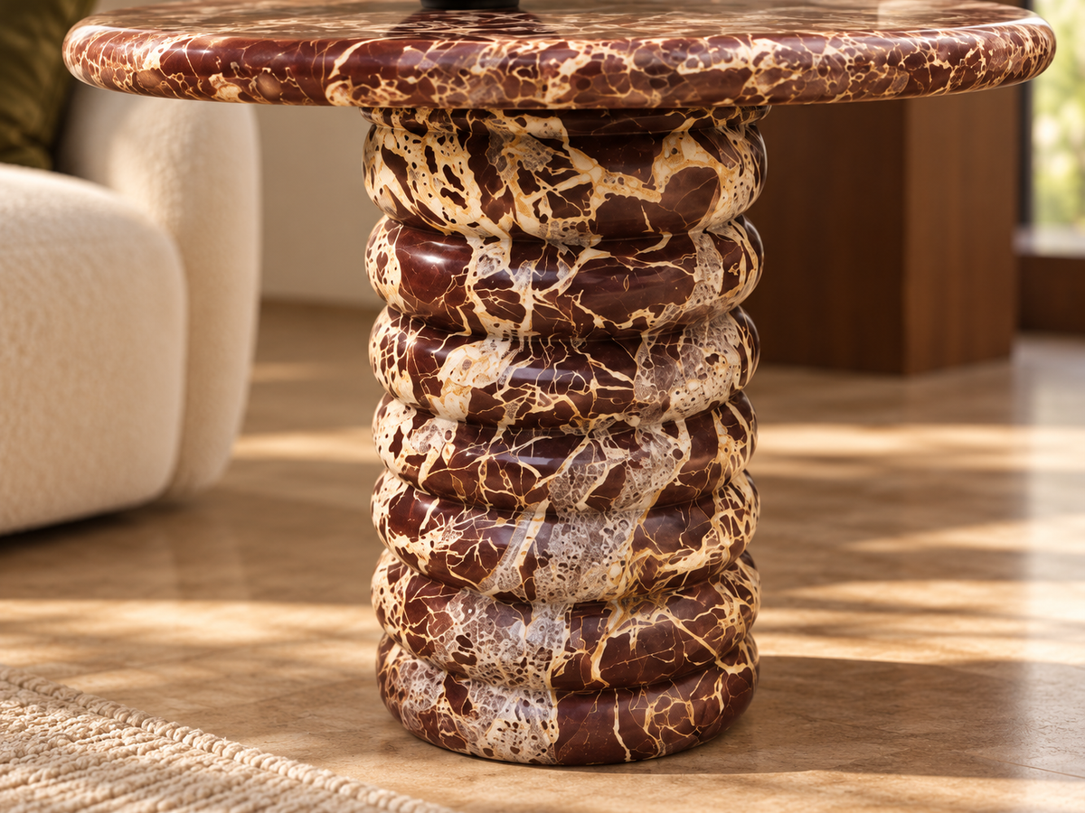 Detailed rich burgundy stone veining and alternating sculptural circular bands of Orsino marble table pedestal