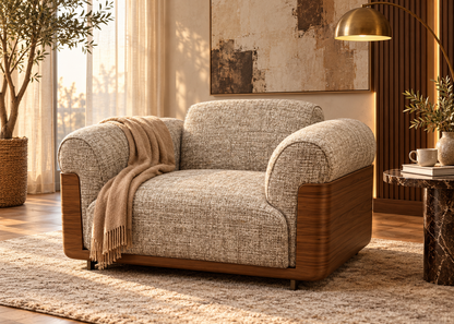 Otello Berger luxury reading armchair in warm greige woven tweed upholstery with large walnut wood side panels and thick rolled arms