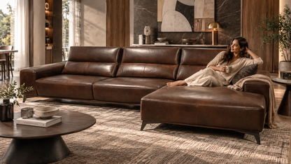 Rovena Leather Lounge Sofa in rich brown leather with chaise in a luxury living room