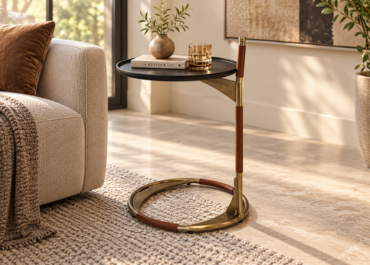 Savio black tray-top C-shaped brass and leather side table beside ivory upholstered sofa