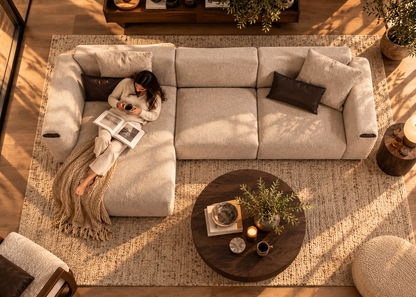 Top-down view of Soho L-shape modular greige bouclé sofa showing deep left chaise, three sections and dark leather arm insets