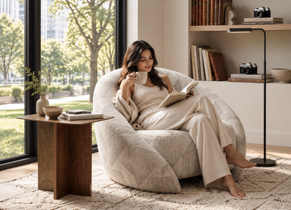 Solenne Armchair styled with a relaxed reader in a modern interior