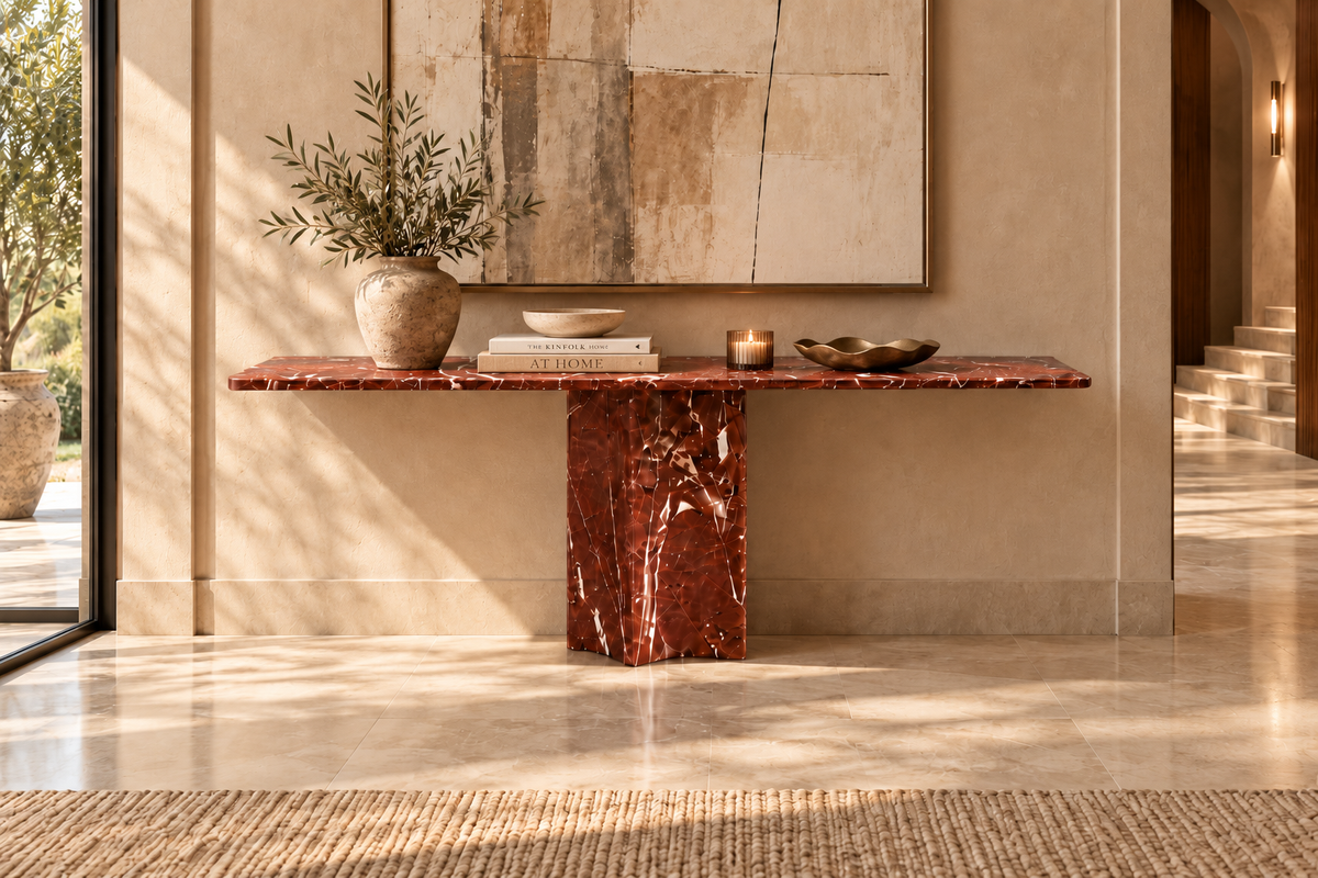 Solenne burgundy marble console table with glossy polished top and single central rectangular pedestal in warm foyer