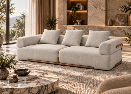 Solenne Sofa 3 seater cream modern sofa with sculpted arms and warm wood base detail in a refined contemporary interior