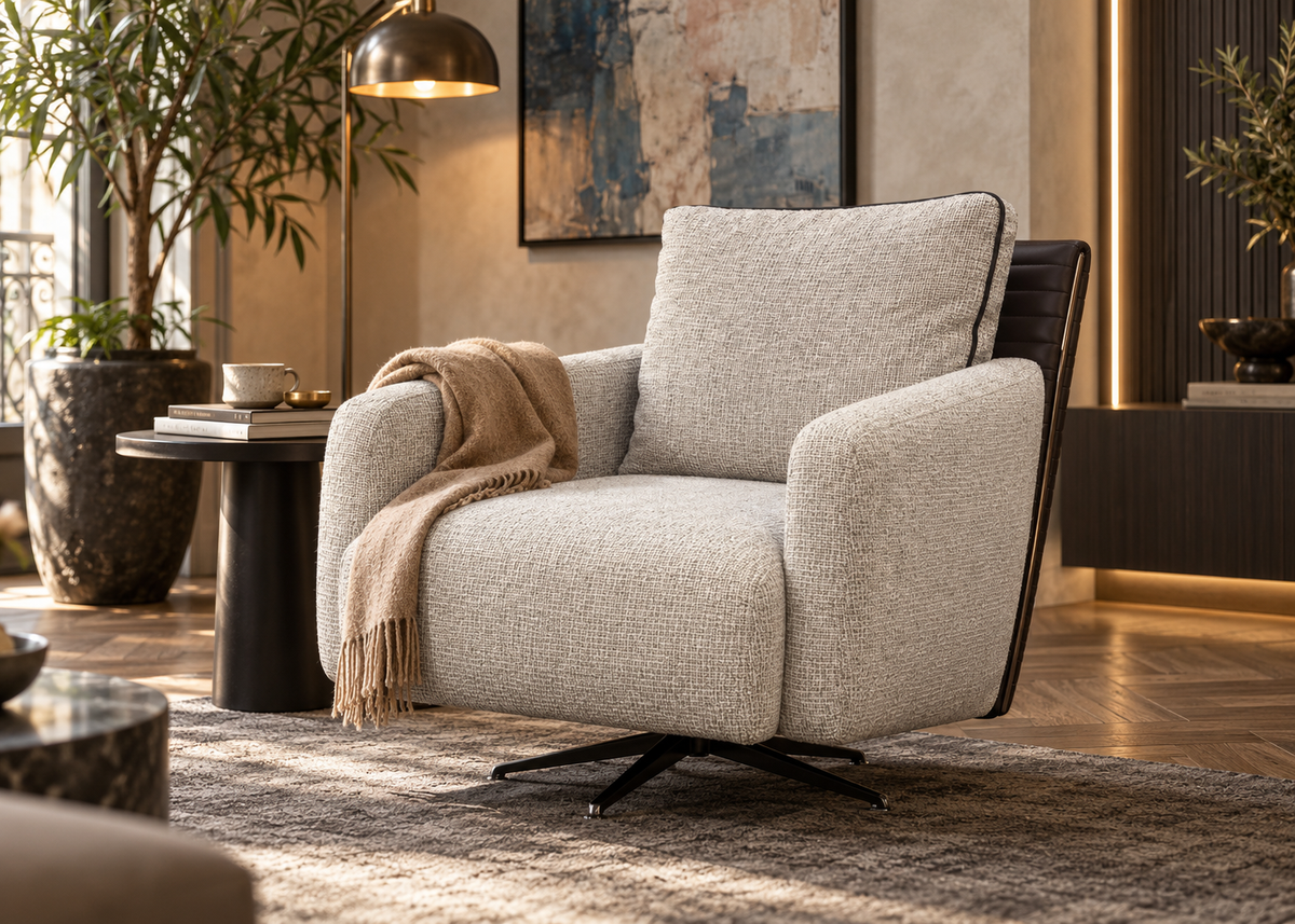 Togo swivel armchair in warm cream salt-and-pepper woven tweed with dark espresso leather back in a luxury European reading nook