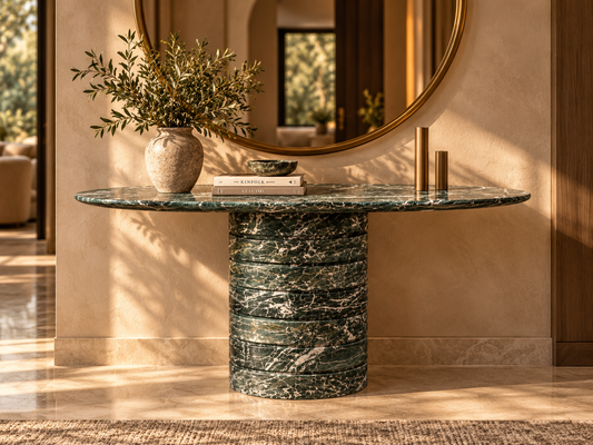 Verde Strata green marble console front-view lifestyle photograph with elongated oval top and one ribbed stacked circular pedestal